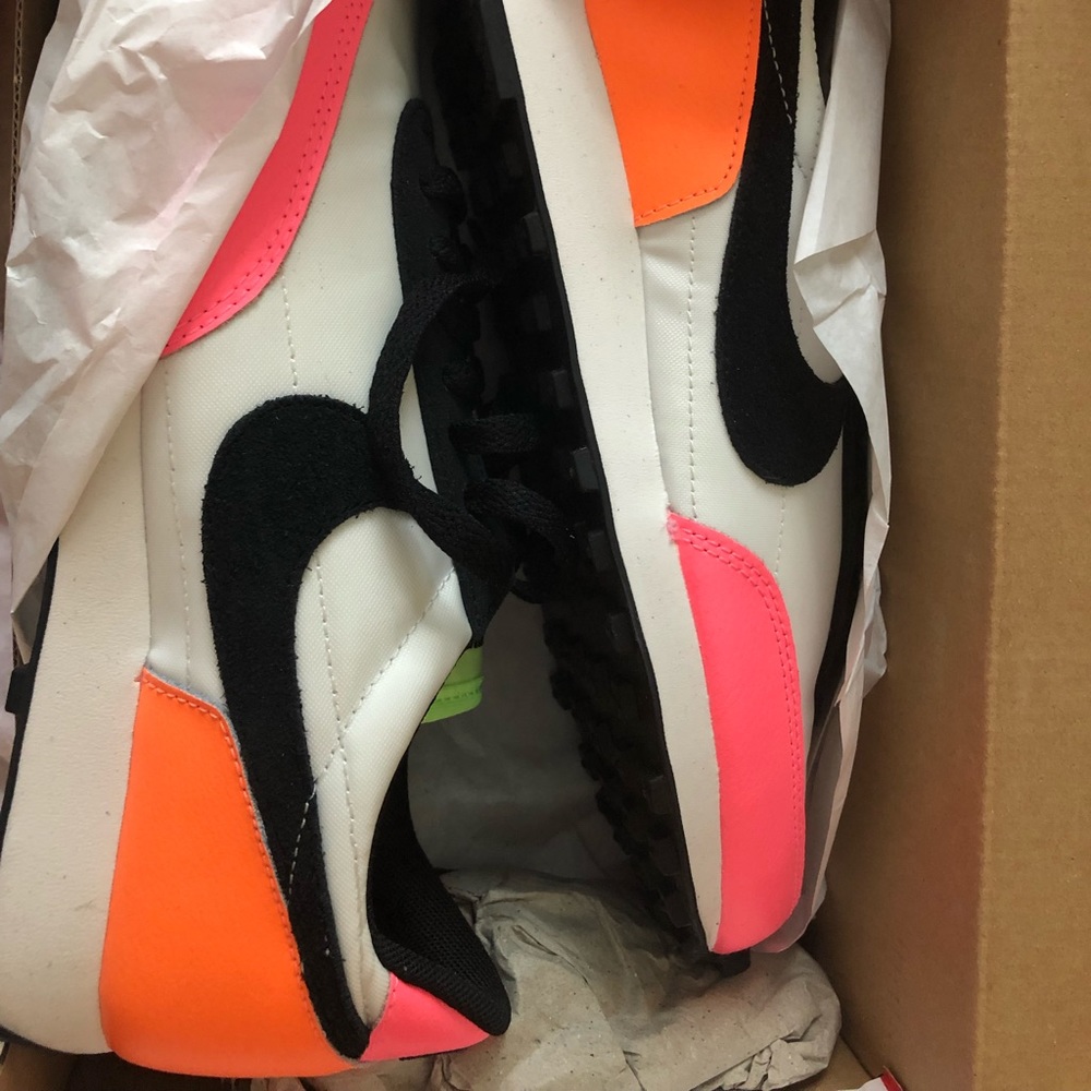 Size 6 multi colored Nike shoes, great for the gym or everyday use.